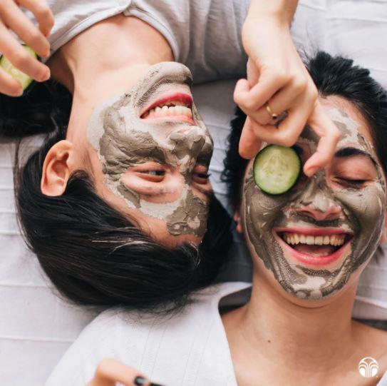 Happy couple with Epoch Glacial Marine Mud mud mask in the face